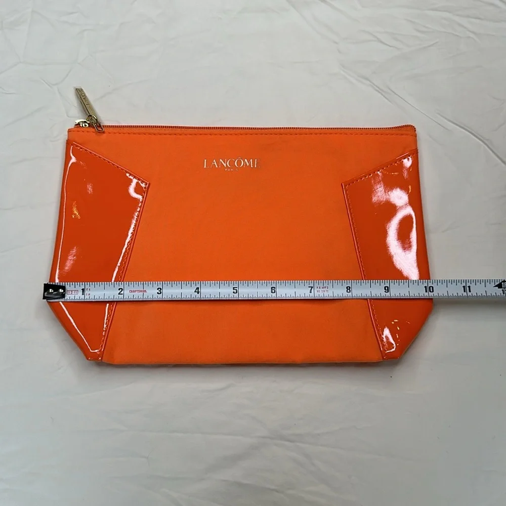 BEAND NEW! Vibrant Orange Cosmetic Bag with Glossy Finish and Zipper Closure.